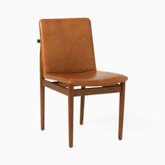 a brown leather chair against a white background