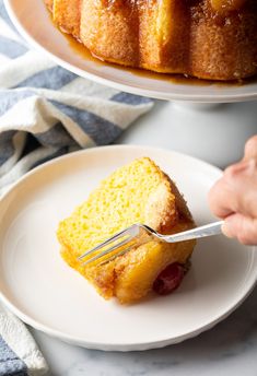 a piece of pineapple upside down bundt cake on a plate with a fork