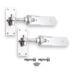 two metal door handles with screws on them