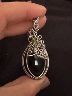 This a handmade Onyx pumpkin in Sterling Silver wire. It's perfect add to your Jewelry collection for fall.  Pendant comes with a complimentary stainless steel chain and a gift box ready for gifting.  All of my pieces are made with high quality wire from Riogrande. These are not costume pieces that will chip away or rust over time. They will last forever if taken care of, which is why I include a free polishing cloth with every order. Quality is very important to me! If you have any questions, I Handmade Silver-plated Wire Necklaces, Handmade Silver Plated Wire Necklaces, Unique Handmade Silver-plated Wire Jewelry, Handmade Black Nature-inspired Jewelry, Handmade Nature-inspired Black Jewelry, Handmade Artisan Jewelry With Silver Plated Wire, Handmade Artisan Silver-plated Wire Jewelry, Handmade Artisan Silver Plated Wire Jewelry, Handmade Artisan Jewelry In Silver Plated Wire