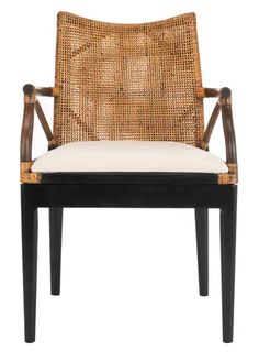 a chair that is made out of wood and wicker with a white seat cushion