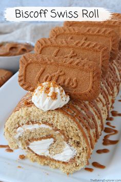 a close up of a piece of cake on a plate with the words biscotti swiss roll