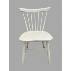 a white wooden chair against a gray background