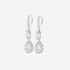 These multi shaped diamond drop earrings are a true symbol of Badgley Mischka's glitz and glam style. Lab grown diamonds are hand set to perfection bringing out the true charm of the design. Luxury Pear-shaped Teardrop Earrings For Formal Occasions, Elegant Sterling Silver Teardrop Earrings With Brilliant Cut, Teardrop Diamond Cut Bridal Earrings For Evening, Fine Jewelry Pear-shaped Diamond Bridal Earrings, Dazzling White Gold Bridal Earrings In Pear Shape, Dazzling White Gold Pear-shaped Bridal Earrings, Luxury Teardrop Diamond Earrings With Halo Design, Luxury Teardrop Diamond Cut Bridal Earrings, Luxury Teardrop Bridal Earrings With Diamond Cut