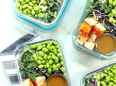 four plastic containers filled with different types of food