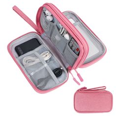 an open pink case with earbuds and other items in it on a white background