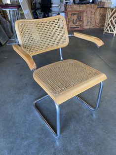 a chair that is made out of wood and has metal frame on the back side