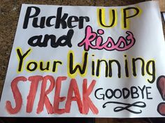 a sign that says pucker up and kiss your winning streak