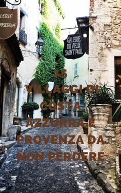 an alley way with stone buildings and plants on the side walk in front of it