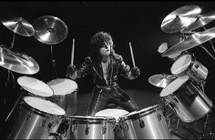 an image of a man playing drums on stage