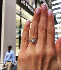 a woman's hand with a ring on it