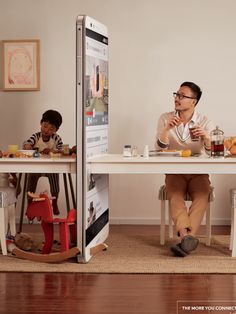 two people sitting at a table with food and drinks