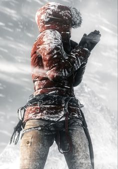 a man standing in the snow with his hands on his hips and looking at something