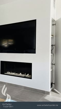 a modern fireplace in a white living room