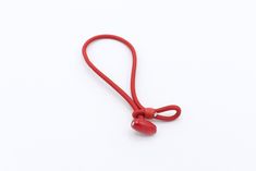 a red lanyard on a white background with clipping for attachments to hold the cord