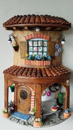 a doll house made out of bricks and clay