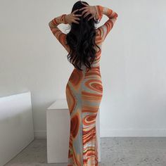 Features: The Patricia V Neck Print Maxi Dress is a perfect mix of style and comfort. Featuring a V neckline, long sleeves, and a body-hugging fit, this dress creates an elegant silhouette that is sure to get you noticed. Crafted with a stylish printed design, this dress is ideal for special occasions or any day-to-day look. Chic Orange Long Sleeve Dress, Fitted Long Sleeve Dress For Spring, Orange Long Sleeve Midi Dress, Spring Long Sleeve Fitted Bodycon Dress, Fitted Long Sleeve Maxi Dress For Fall, Fitted Long Sleeve Bodycon Dress For Spring, Fitted Long Sleeve Dress For Fall, Elegant Orange Long Sleeve Maxi Dress, Elegant Long Sleeve Orange Maxi Dress