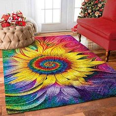 a brightly colored rug with a sunflower design on it in front of a christmas tree