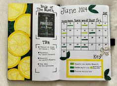 an open calendar book with lemons on it