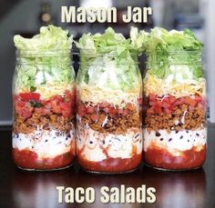 four mason jars filled with different types of food