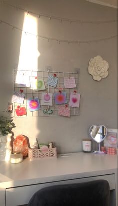 a white desk topped with lots of magnets