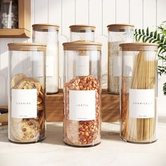 three glass containers filled with food on top of a counter