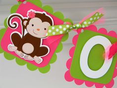 a monkey themed birthday banner hanging from a door with the number 0 on it's side