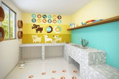 a bathroom with tiled floors and walls painted in yellow, blue, and white colors