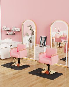 two pink chairs sitting in front of mirrors on top of a hard wood floor next to each other