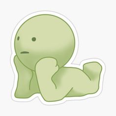 a green sticker with an image of a baby alien laying on it's stomach