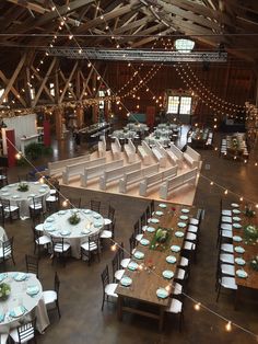 an indoor venue with tables and chairs set up