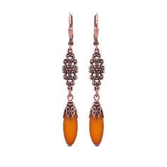 Artisan Czech glass table cut oval beads in a silky pumpkin orange color with Picasso detailing. The beads are complemented with antiqued copper details with a lacy floral motif. These beads are made in the Czech Republic in small quantities and so are of a very limited edition. --------------------------------------------------------------------------------------------- Details: - Beads are artisan Czech glass - Ear wires are antiqued copper-plated brass, lead-free and nickel-free Dimensions: - Pumpkin Orange Color, Navy Blue Jewelry, Oval Beads, Blue Jewelry, Victorian Jewelry, Copper Plated, Pumpkin Orange, Czech Glass Beads, Glass Table