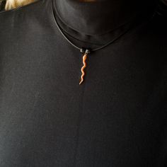 "I loved designing this pretty corn snake necklace! It is a detailed design, painted with shimmery orange translucent paint. The snake pendant measures 1 1/2\" long and is 1/8\" wide. Your Magic Zoo pewter necklace will come ready to wear on an 18\" cord with a lobster clasp. It will include 2 glass beads. Your Magic Zoo enamel necklace will come ready to wear on an 18\" cord with a lobster clasp. It will include 2 glass beads. If you would care for a different color bead than the one in the pho Orange Choker Necklace For Gift, Adjustable Orange Choker Jewelry, Orange Choker Jewelry For Gift, Unique Adjustable Snake Chain Necklace, Adjustable Orange Necklace For Gifts, Adjustable Orange Necklace For Gift, Handmade Orange Choker For Gifts, Handmade Orange Choker As Gift, Unique Orange Pendant Necklace