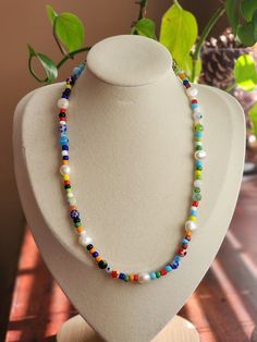 ✨This is a perfect necklace to add some color to your everyday outfit! It consists of: Millefiori beads Multicolor seed beads Cultured pearls Silver and stainless steel finishings. Strong Nylon Wire Cord Love & Care 📏Length: This necklace measures at 16.5 inches from clasp. There is a 2.36 inch extender available. Please let me know in the notes box at checkout if you would like one. 📦Packaging: Every necklace is carefully placed in a velvet lined box or pouch to maintain quality. *Necklace Care* To ensure the longevity of your necklace, handle with delicate care. Please wait until all lotions, perfumes or oils have dried before putting on. Do not wear in shower or while working out. Clean and polish your beads with a soft cloth.(provided in packaging) Make sure to remove before sleeping Seed Bead Necklace, Dainty Necklace, Silver Pearls, Cultured Pearls, Everyday Outfits, Seed Beads, Lotion, Pearl Necklace, Necklace Etsy