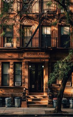 an apartment building with stairs leading up to it