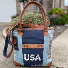 Blue two tone tote canvas and leather bag crafted of repurposed and upcycled sustainable Military Canvas into this great purse or tote bag. Plenty of room for everything you need. Convenient front pocket and adjustable crossbody strap make it the perfect bag to show your pride with ease, d comfort and style! A perfect gift for all those patriotic peeps, military moms, wives and all that just love a quality bag. 17" x 14.5" x 4" <<-- Please Check the DIMs! Fully Lined Inside Zip top Closure Leath Upcycled Tote Shoulder Bag For Everyday, Upcycled Everyday Tote Shoulder Bag, Everyday Upcycled Tote Shoulder Bag, Blue Canvas Shoulder Bag With Leather Trim, Vintage Upcycled Shoulder Bag For Everyday Use, Blue Canvas Satchel Tote, Upcycled Satchel Bag For Everyday Use, Vintage Upcycled Everyday Shoulder Bag, Casual Blue Shoulder Bag With Leather Trim