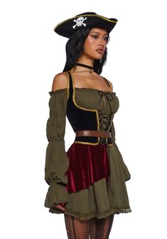 a woman in a pirate costume is standing with her hands on her hips and looking at the camera