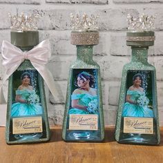 two bottle shaped like princesses sitting next to each other