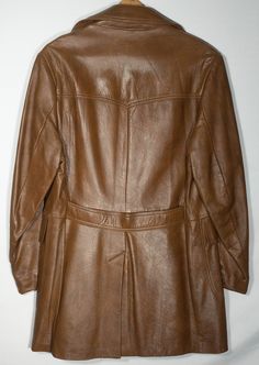 This boho retro leather coat classic is a late 1970s Reed original that is a milk chocolate brown color with a wide lapel, back waistband and dart tailored details including a satin-feel lining. This trench cut leather jacket has convenient front pockets too. It's in really great overall condition with normal signs of wear/age/use and some more slight scuffing at the cuff - shown in last photo close-up. The label does not show size, so flat measurements in inches are included here for you to check fit. This classic leather 70's retro trench style coat is really sweet! Check out the photos of this stunning long coat! --flat measurements, please double for circumference--     Chest, armpit to armpit: 21"     Shoulder to shoulder: 19"     Shoulder to hem: 36"     Sleeve, armpit to cuff: 17" Vintage Leather Coat, Coat Classic, Chocolate Brown Colour, Brown Line, Style Coat, Boho Retro, 70s Retro, Line Jackets, Classic Leather