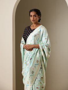 Experience the charm of heritage with contemporary flair through the Shikargah Collection Banarasi Silk Saree. Elevate your wardrobe and invite a sense of nobility into your fashion choices. Discover unmatched elegance as you seamlessly weave the tapestry of tradition into your personal style. Designer Salwar Kameez With Meenakari And Traditional Drape, Designer Meenakari Jamawar Kurta, Pre-draped Handloom Jamawar Saree, Traditional Meenakari Semi-stitched Kurta, Elegant Meenakari Kurta For Diwali, Elegant Pista Green Jamawar Traditional Wear, Designer Jamawar Handloom Saree, Semi-stitched Meenakari Kurta With Traditional Drape, Semi-stitched Pista Green Traditional Wear With Motifs