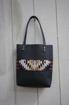 Hey, I found this really awesome Etsy listing at https://www.etsy.com/listing/249214682/black-leather-and-wool-porter-tote Black Leather Bags With Leather Handles, Black Leather Lined Tote Bag, Black Shoulder Bag With Leather Lining For Errands, Wool Patterns, Wool Tote, Handmade Leather Bag, Leather Ideas, Leather Totes, Tote Bags Sewing