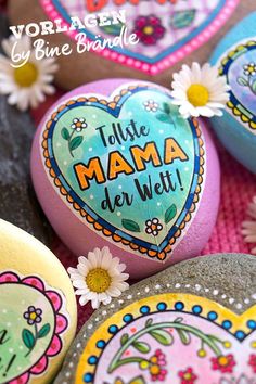 colorful painted rocks with flowers on them and the words i love mama de witt