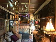 a living room filled with furniture and a chandelier