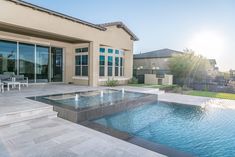 a house with a pool and patio area