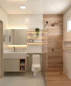 a bathroom with a toilet, sink and mirror