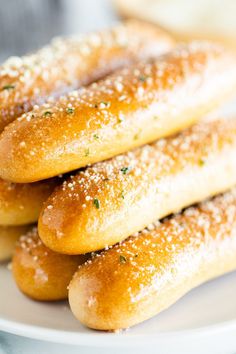 some bread sticks are stacked on top of each other with a fork sticking out of them