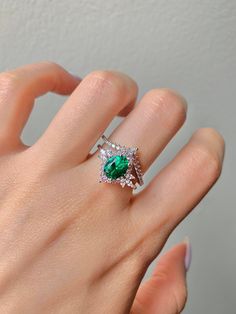 This gorgeous, timeless ring features our favorite emerald design and hand picked crystals. This is a 2 piece set. ✦ DETAILS ✦ ✧ Handcrafted ✧ 1.60 Carat center stone ✧ Emerald and crystals ✧ Sizes 3.75-11.25 ✧ Sterling Silver 925 ✧ This ring will arrive ready to gift in a Kherish Jewelry Pouch. ✧ PRE-ORDER: Items that are preorder only will ship within 10-15 business days. You will receive an email with the updated processing time if you order a size/option that qualifies for pre-order. ✧ Due t Vintage Emerald Ring, Etsy Engagement Rings, Emerald Ring Vintage, Timeless Ring, Sterling Silver Engagement Rings, May Birthstone, Jewelry Birthday, Emerald Jewelry, Matching Band