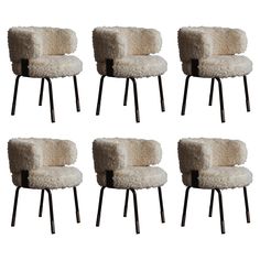 six sheepskin chairs with black metal legs