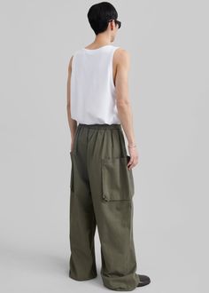 Color: Khaki  Midweight cotton fabric Relaxed fit Wide leg Large front pockets  Large back pockets Elasticated waist with a drawstring Slip-on style Unlined 100% Cotton Dry Clean By The Frankie Shop. Imported Drawstring Cargo Pants, Paris Store, Denim Suit, The Frankie Shop, Frankie Shop, Paris Woman, Leather Texture, Swimwear Accessories, Color Khaki