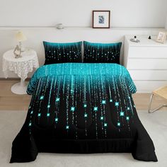 a bed with blue and green stars on it